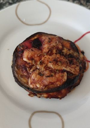 Una foto de Timbal de berenjena estilo pizza
