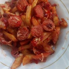 A picture of Chips masala and fried sausages.