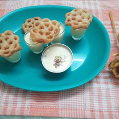 A picture of Sweet Flower Khaja (Achappam) with Rabadi (fusion).