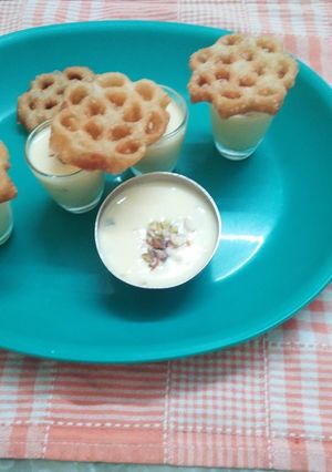 A picture of Sweet Flower Khaja (Achappam) with Rabadi (fusion).