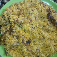A picture of Jollof rice and beans.