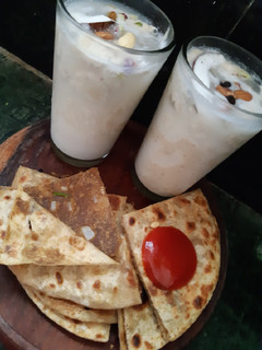 A picture of Coconut dry fruit shake with sattu paratha.