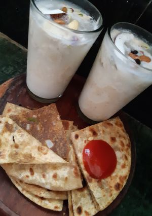 A picture of Coconut dry fruit shake with sattu paratha.