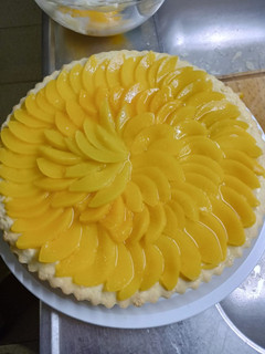 Una foto de 🍑Tarta de duraznos y crema pastelera