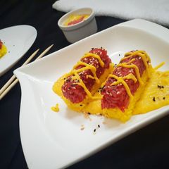 A picture of Colourful sticky rice with creamy sauce.