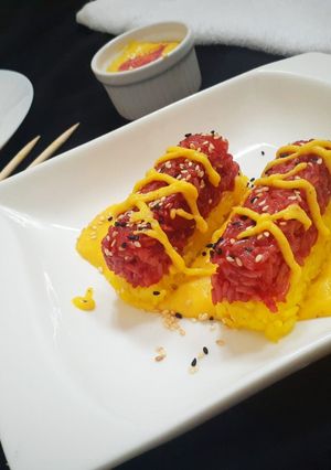 A picture of Colourful sticky rice with creamy sauce.