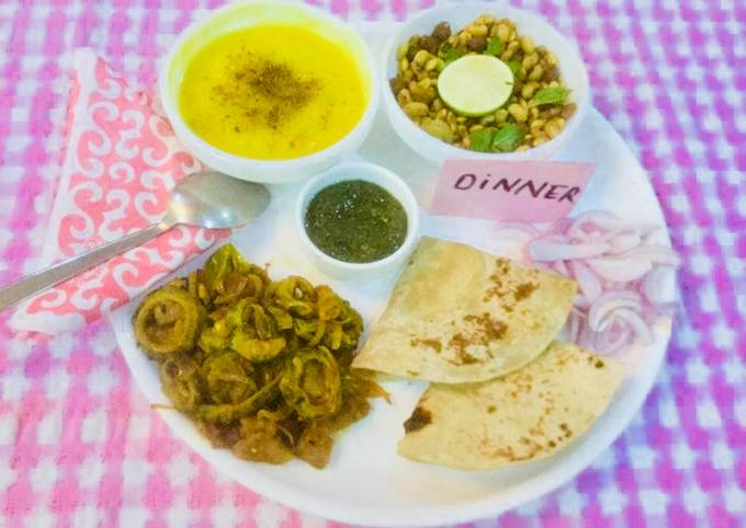 Yellow Moong Dal,Karela,Onions Bhaji,Whole lentils salad,mint chutney,Chapatis