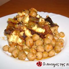 A picture of Chickpeas in the Dutch oven with eggplants.