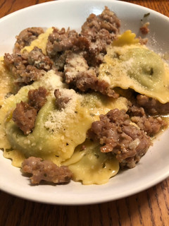 A picture of Easy Ravioli in a sausage, garlic, and wine sauce.