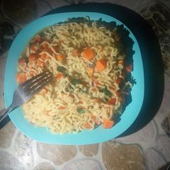 A picture of Carrots and moringa noodles.