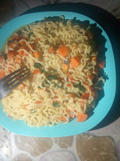 A picture of Carrots and moringa noodles.