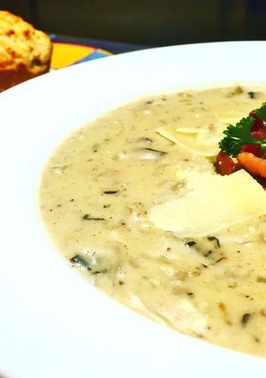 A picture of Cream of Mushroom Soup with Parmesan Cheese and Applewood Smoked Bacon.