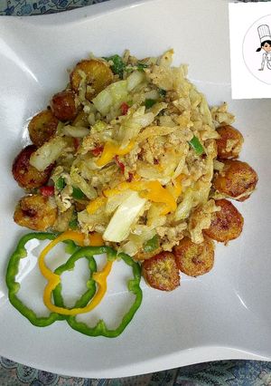 A picture of Fried plantain with steamed cabbage and egg.