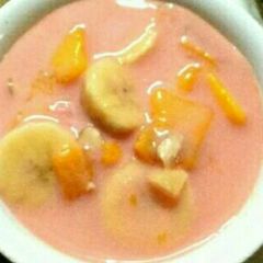 A picture of Orange flavoured fruit raita.