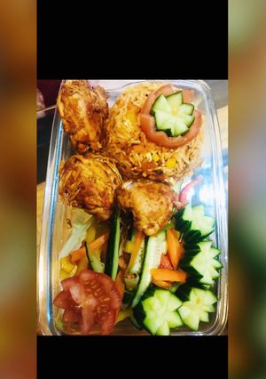 A picture of Chicken tikka with veg fried rice.