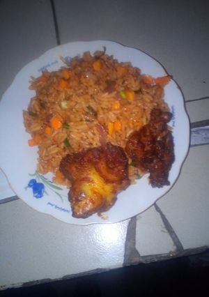 A picture of Garnish jollof and pepper chicken.