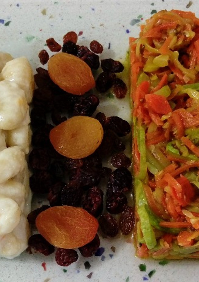 Una foto de Gnocchis en leche de coco y salteado de espaguetis de verduras con anís y frutos secos