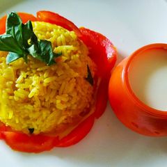Masala tomato rice with mitha dahi A picture of Masala tomato rice with mitha dahi.