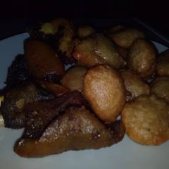 A picture of Puff puff and fried goat meat.