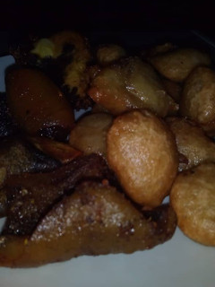 A picture of Puff puff and fried goat meat.