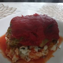 A picture of Mama's Stuffed Cabbage Over Mashed Potatoes.
