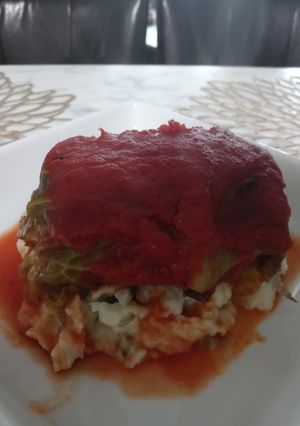 A picture of Mama's Stuffed Cabbage Over Mashed Potatoes.