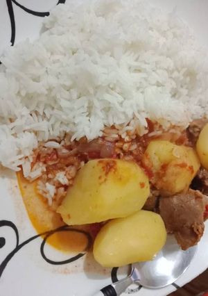 A picture of Beef n Potato stew with rice.