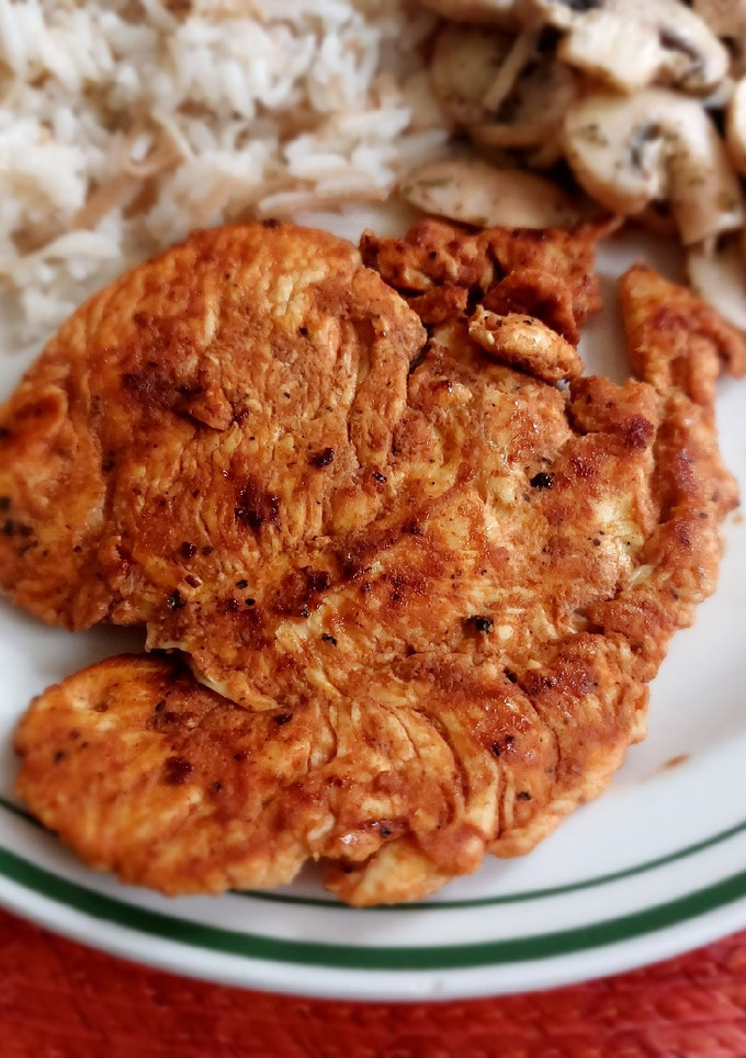 Una foto de Milanesas de pollo asadas a la Valentina