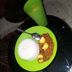 Egg curry and rice A picture of Egg curry and rice.