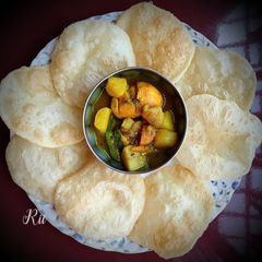Loochi Poori and egg curry A picture of Loochi Poori and egg curry.