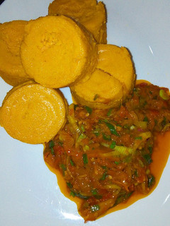 A picture of Moin moin with palm oil sauce.