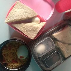 A picture of Sandwiches,boiled eggs and noodles.