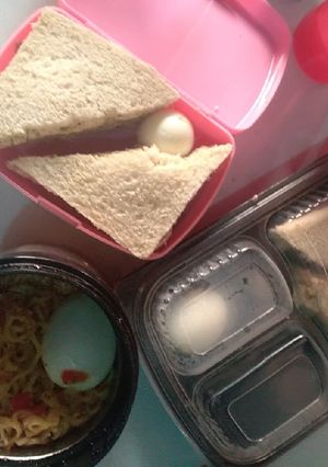 A picture of Sandwiches,boiled eggs and noodles.