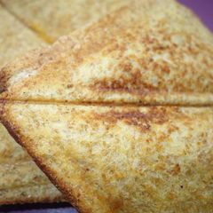 A picture of Toasted cheese and tomato.