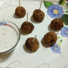 A picture of Potato lollilop with dip sauce.