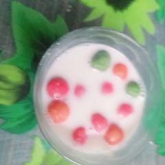 A picture of Ping pong rice balls in coconut milk.
