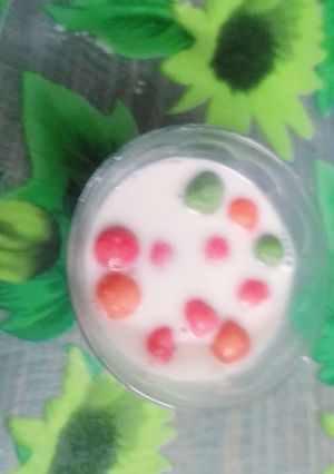 A picture of Ping pong rice balls in coconut milk.
