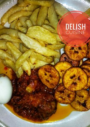 A picture of Fried Irish potato/plantain and boiled egg with pepper sauce.