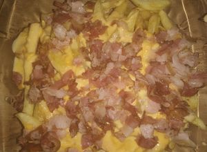 Una foto de 🍟Papas con cheddar y bacon🥓