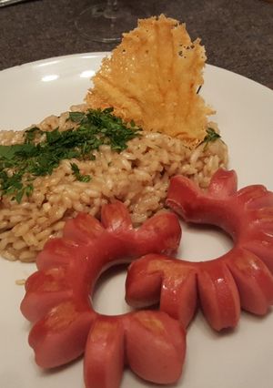 Una foto de Salchichas asadas con risotto de hongos