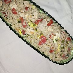 A picture of Fried rice with chicken.