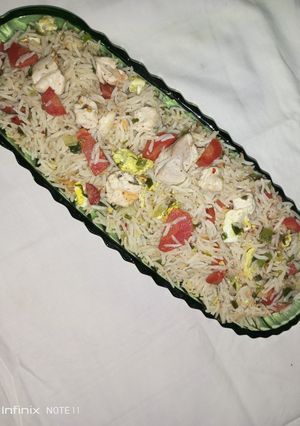 A picture of Fried rice with chicken.