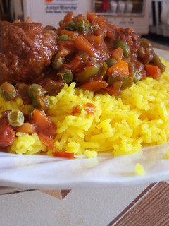 A picture of Turmeric Rice And Meat Balls with Peas.