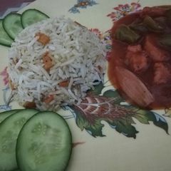 A picture of Chicken Manchurian with egg fried rice.