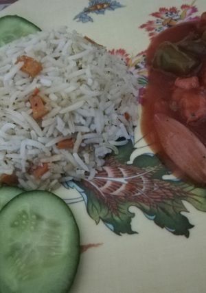 A picture of Chicken Manchurian with egg fried rice.