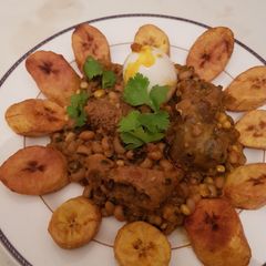 A picture of Beans porridge and sweet corn with plantain.