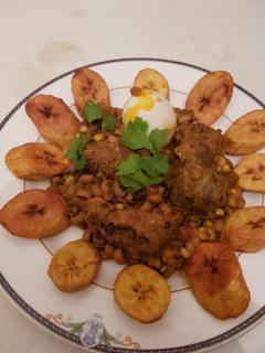 A picture of Beans porridge and sweet corn with plantain.