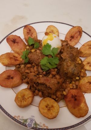 A picture of Beans porridge and sweet corn with plantain.