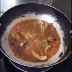 A picture of Pork on Tomato sauté with Fish sauce (kinamatisan pork-chop).