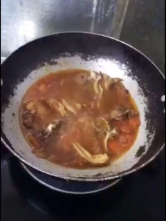 A picture of Pork on Tomato sauté with Fish sauce (kinamatisan pork-chop).